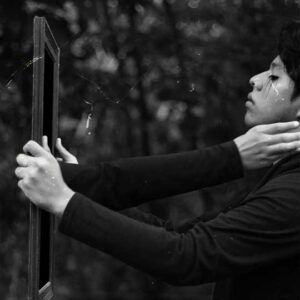 Thumbnail of man doing shadow work to represent emotional healing of anxiety, trauma, & fear via emotional fitness training.